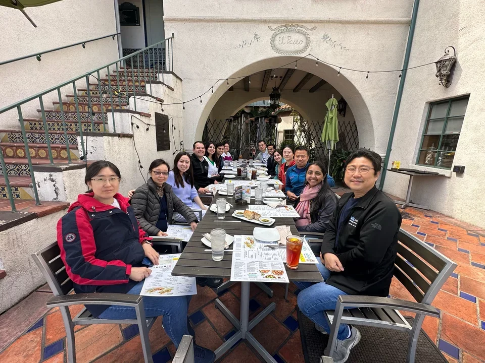 Welcoming our new graduate student Aniketa with a meal on an outdoor table 