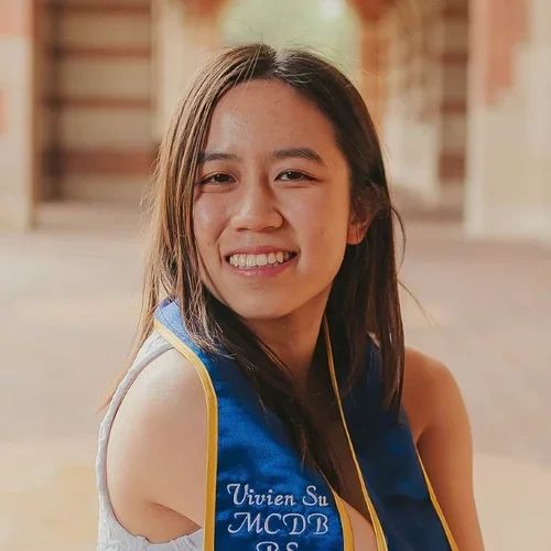 Vivien Su outside at graduation with sash